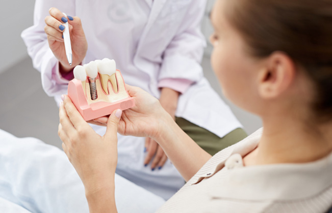 Patient in Federal Way talking with dentist about dental implants