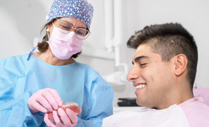 Patient in Federal Way talking to dentist about dental implants
